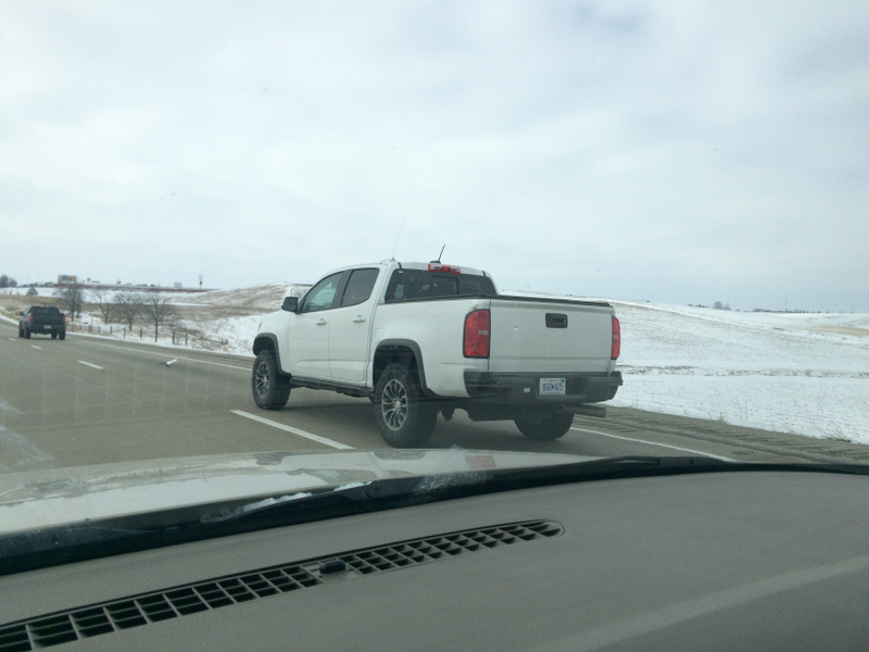 One of the new ZR2s from the rear with a Canyon in front of it.